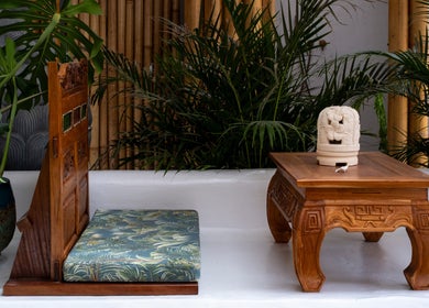 Relaxing seating area at Asia Spa Lanzarote, Teguise, Canarias, ES, showcasing traditional wooden decor.