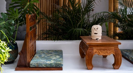 Relaxing seating area at Asia Spa Lanzarote, Teguise, Canarias, ES, showcasing traditional wooden decor.