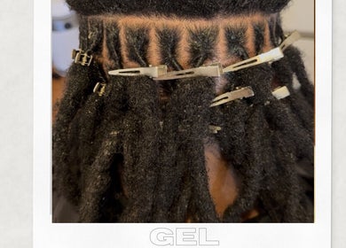 Dreadlocks styled with clips at Locked In Avenue, Melbourne, Victoria, AU for a professional look.