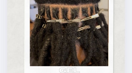 Dreadlocks styled with clips at Locked In Avenue, Melbourne, Victoria, AU for a professional look.