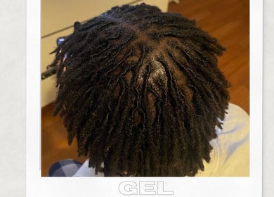 Intricate dreadlock style at Locked In Avenue, Melbourne, Victoria, AU.