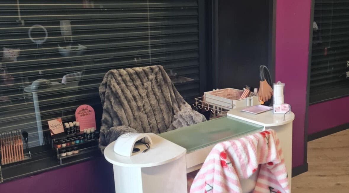 Nail station at Slayed.by.steffy in Ayr, Scotland, GB, featuring plush chair and nail care essentials.
