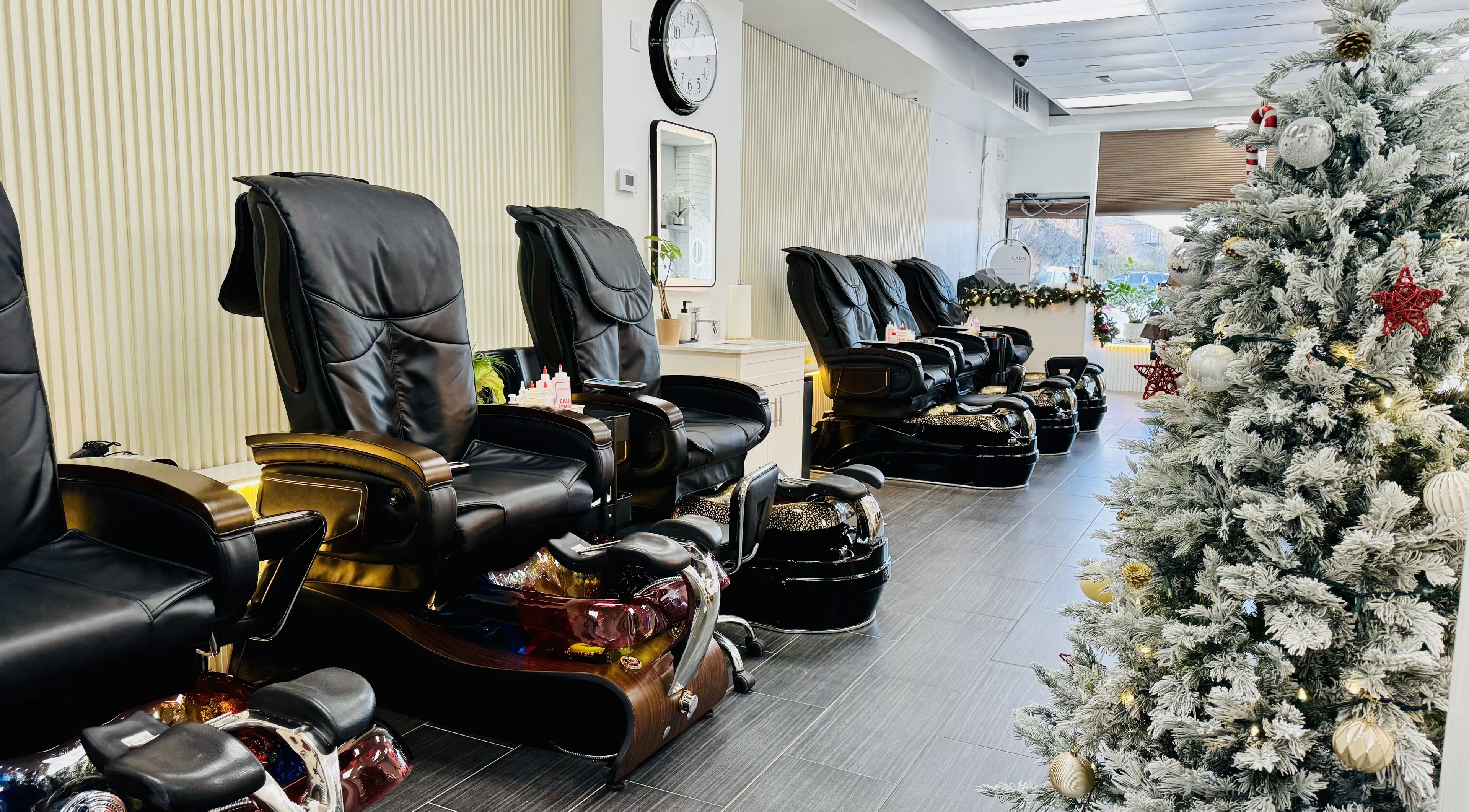 Luxury pedicure chairs at On Her Nails, Toronto, Ontario, CA adorned with festive decorations.