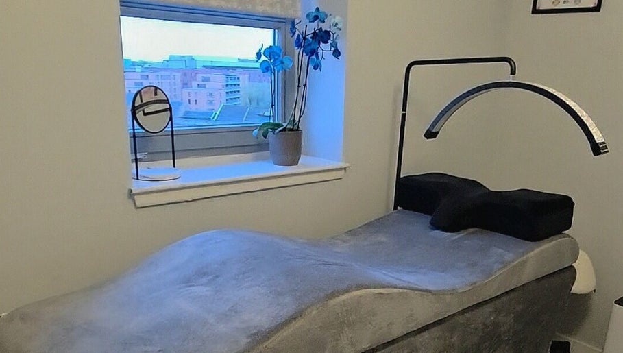 Luxurious treatment room at Chic Beauty By M.W, Edinburgh, Scotland, GB. Modern design with cozy ambiance.