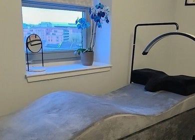 Luxurious treatment room at Chic Beauty By M.W, Edinburgh, Scotland, GB. Modern design with cozy ambiance.