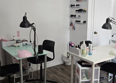 Modern nail station setup at Flexia Ongles & Soins, Saint-Jacques, CA, featuring tools and products.
