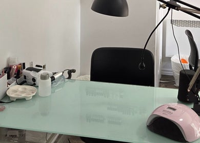 Nail care station at Flexia Ongles & Soins, Saint-Jacques, CA with tools and UV lamp.