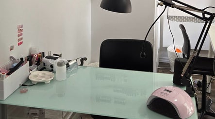 Nail care station at Flexia Ongles & Soins, Saint-Jacques, CA with tools and UV lamp.