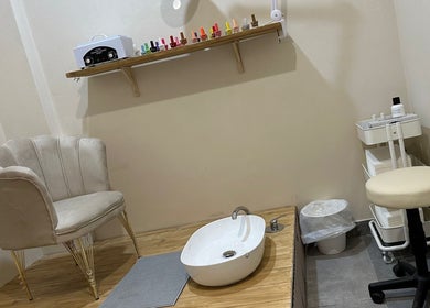 Chic nail care station at Glam nails by sheemu, Roma, Lazio, IT with plush seating and pedicure setup.
