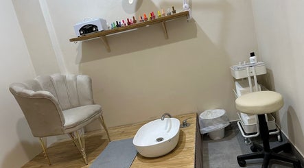 Chic nail care station at Glam nails by sheemu, Roma, Lazio, IT with plush seating and pedicure setup.