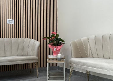 Elegant seating at Glam Nails by Sheemu in Roma, Lazio, IT with plush sofas and modern decor.