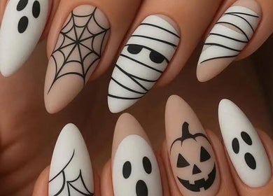 Halloween-themed nail art with ghosts and spiderwebs at Glam Nails by Sheemu, Roma, Lazio, IT.