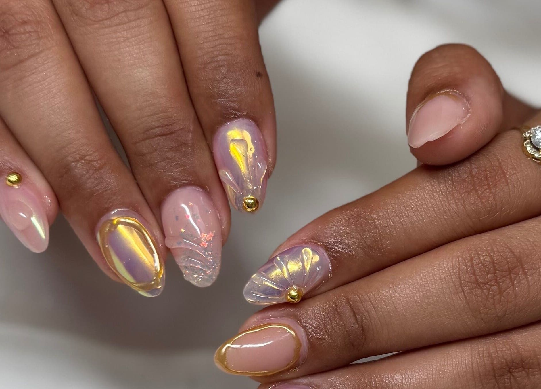 Elegant nail art with gold accents at Kai nails in Aguada, Aguada, PR.