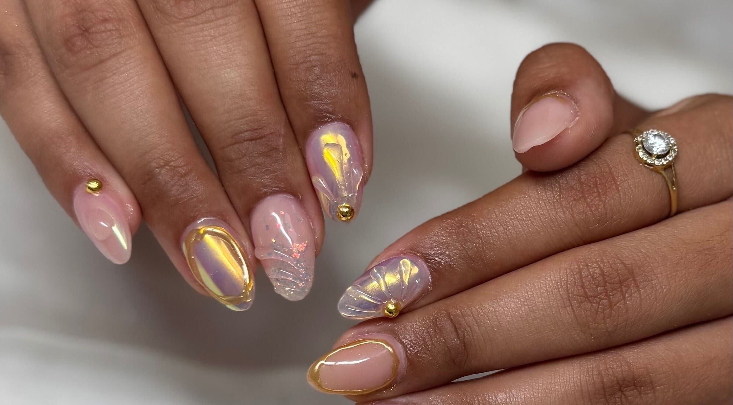 Elegant nail art with gold accents at Kai nails in Aguada, Aguada, PR.