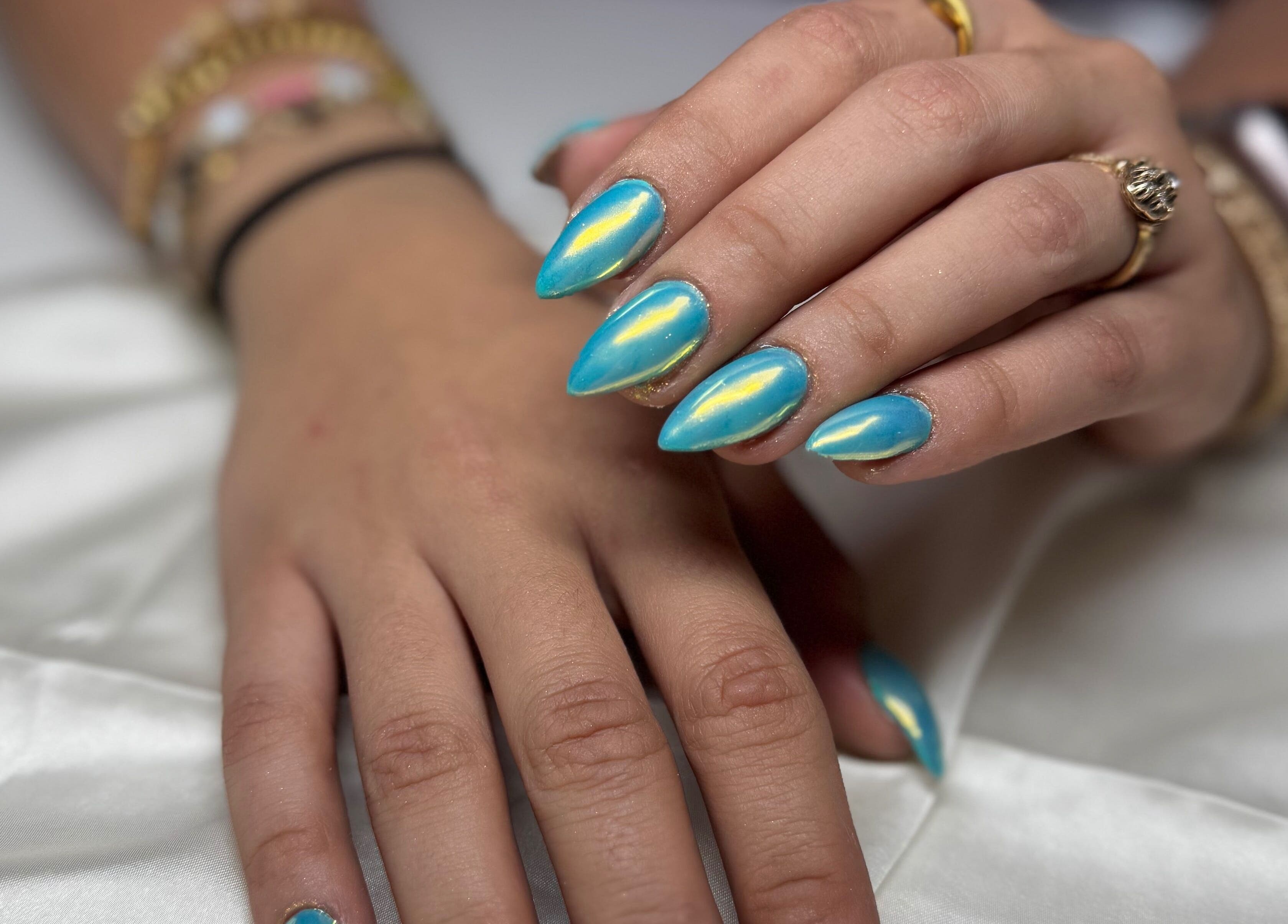 Blue iridescent nails at Kai nails, Aguada, Aguada, PR showcasing stylish nail art.