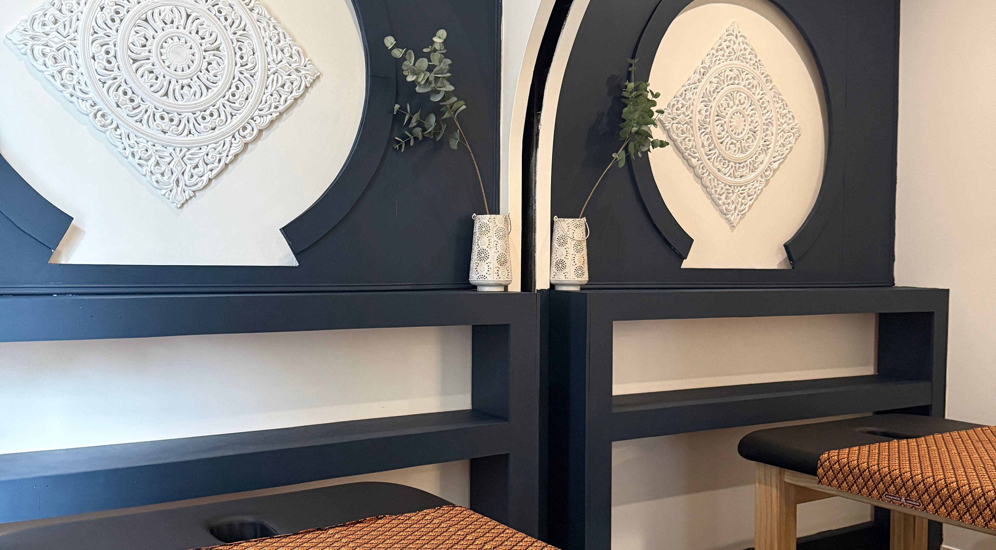 Serene interior view at Sanctuary Kumeu, Kumeū, Auckland, NZ, featuring decorative wall designs.