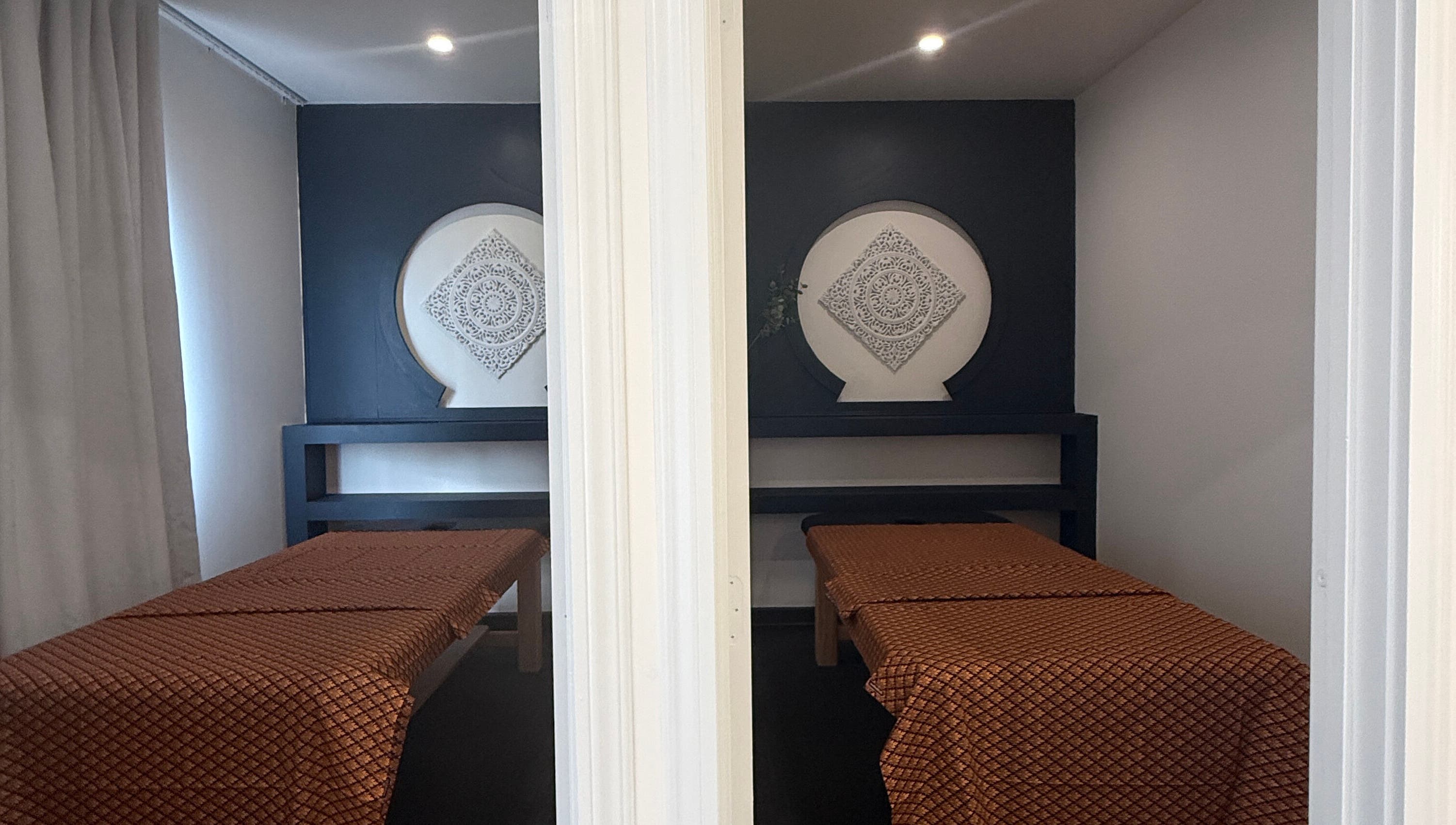 Relaxing massage room at Sanctuary Kumeu in Kumeū, Auckland, NZ with elegant decor and calming ambiance.