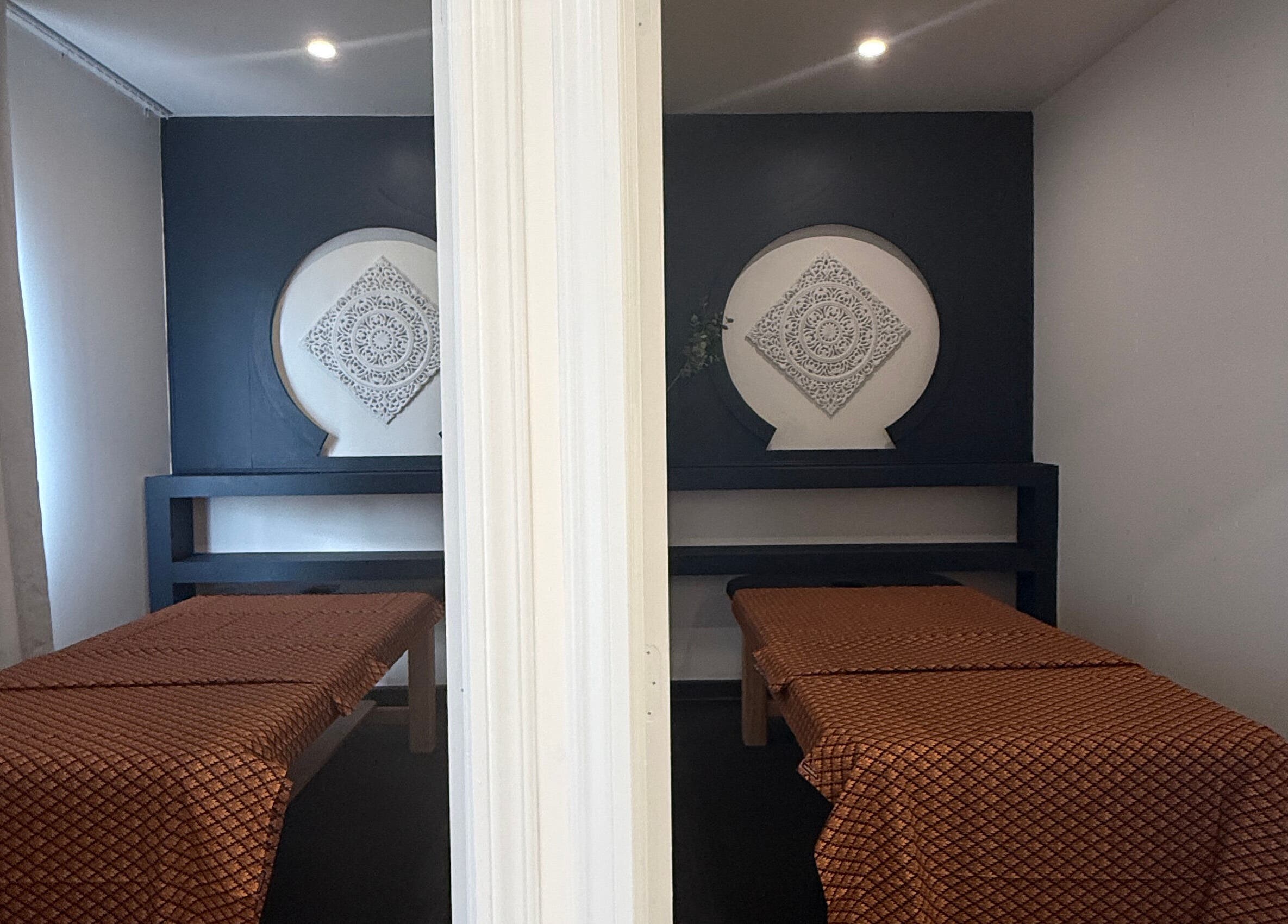 Relaxing massage room at Sanctuary Kumeu in Kumeū, Auckland, NZ with elegant decor and calming ambiance.