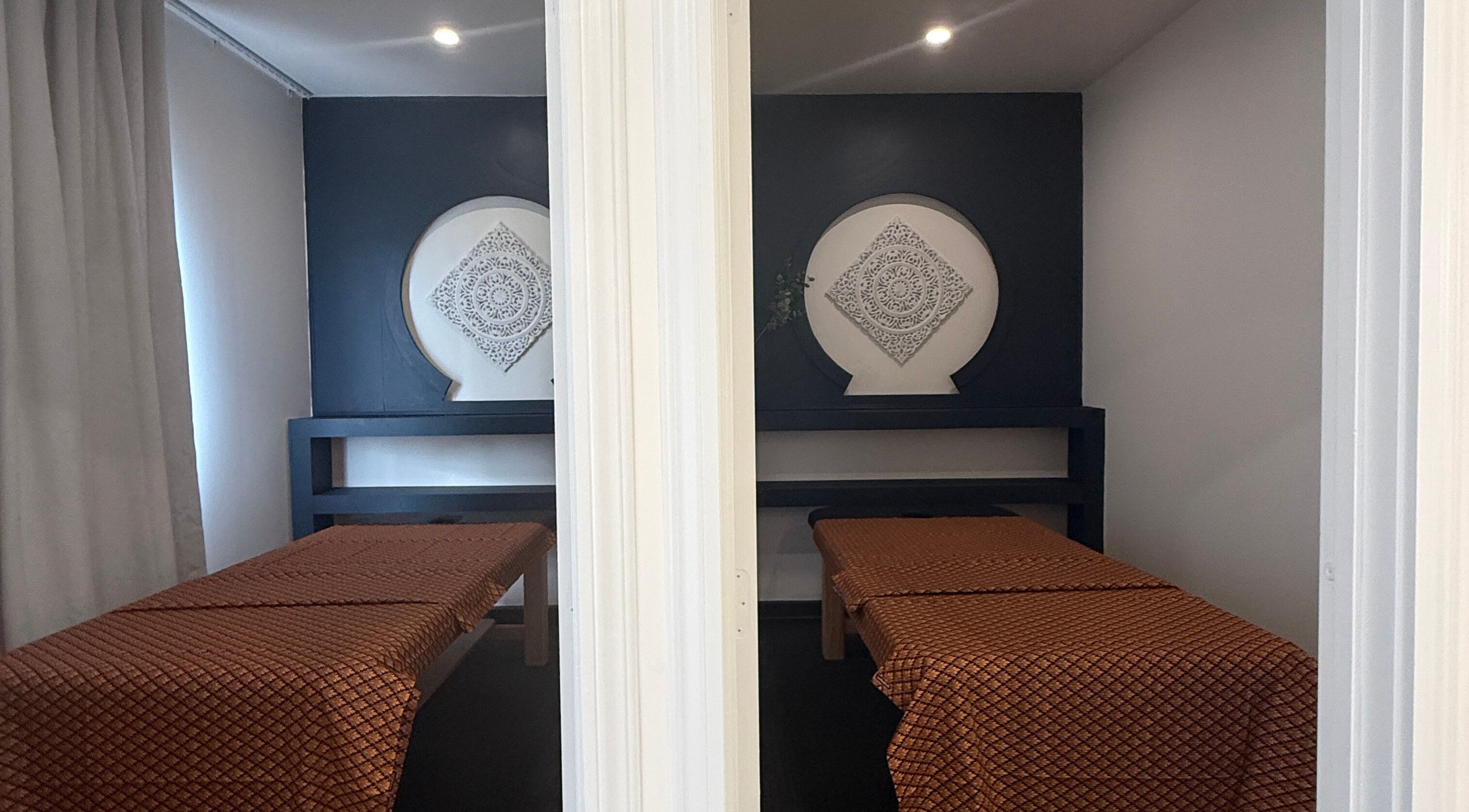Relaxing massage room at Sanctuary Kumeu in Kumeū, Auckland, NZ with elegant decor and calming ambiance.