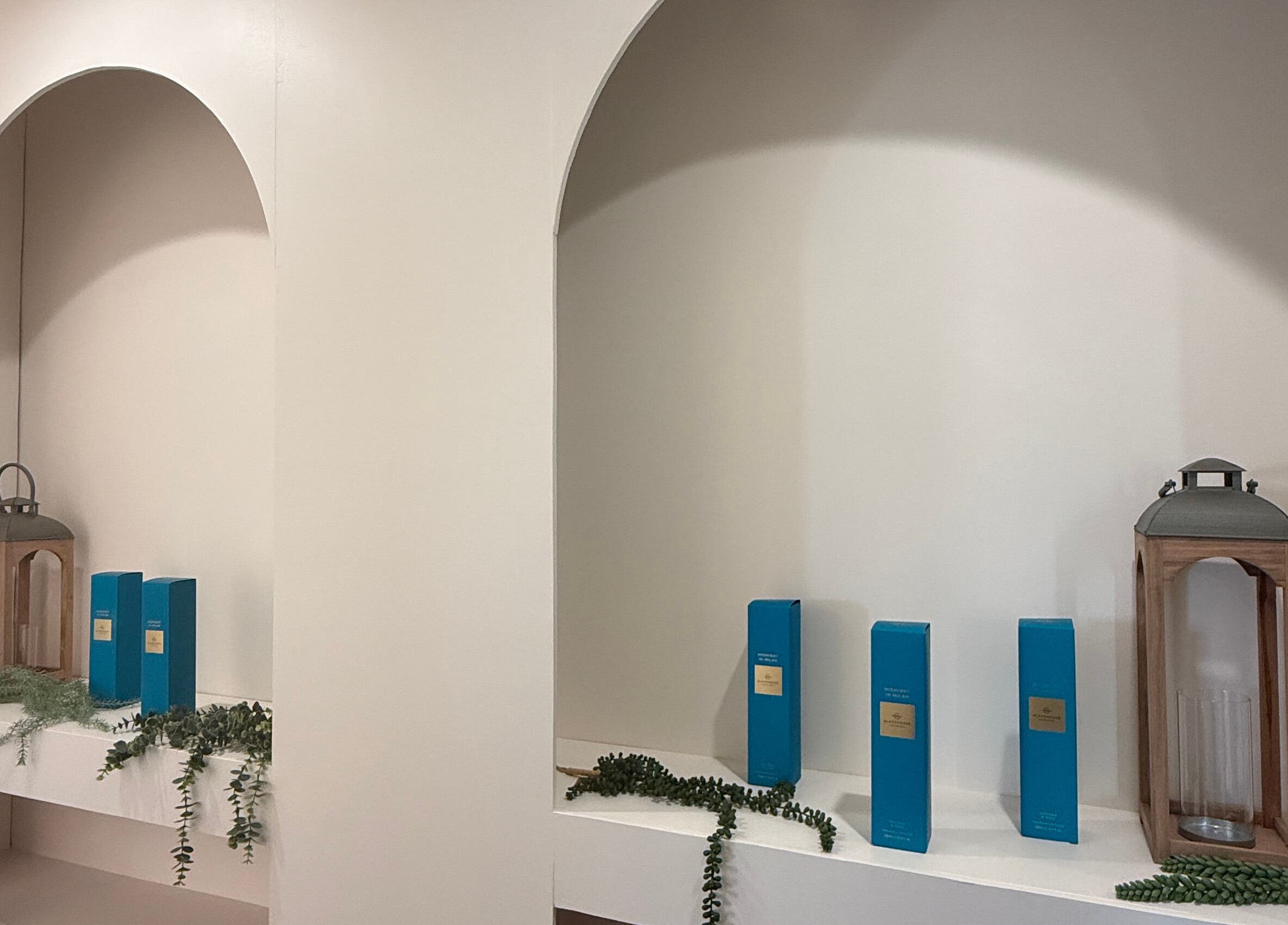 Tranquil shelf display with decor and products at Sanctuary Kumeu, Kumeū, Auckland, NZ.