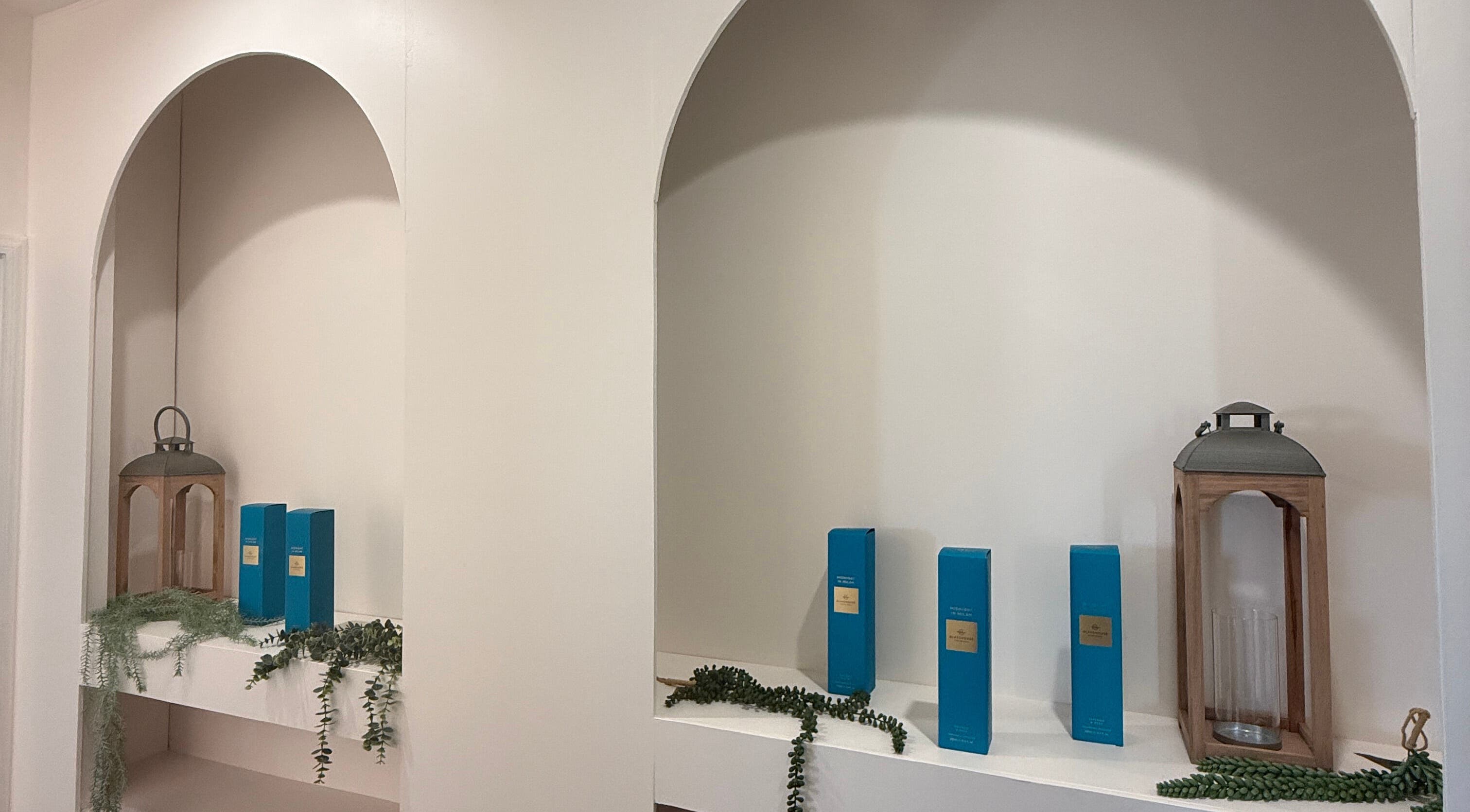 Tranquil shelf display with decor and products at Sanctuary Kumeu, Kumeū, Auckland, NZ.