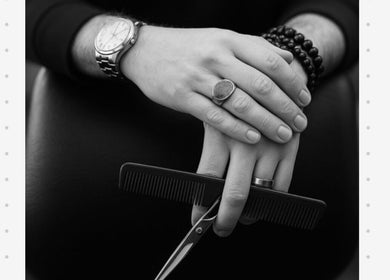 Hands with a comb and scissors at Joseph Botero, Melbourne, Victoria, AU, showcasing professional styling.