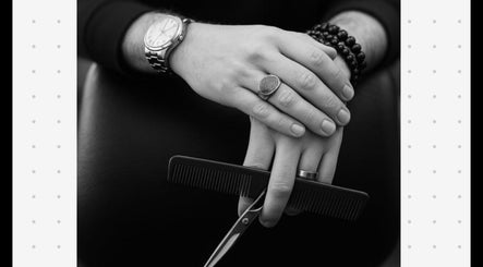 Hands with a comb and scissors at Joseph Botero, Melbourne, Victoria, AU, showcasing professional styling.