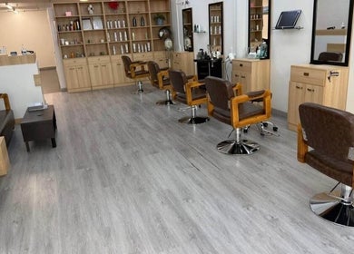 Modern styling chairs and shelves at The Glam Loft in Auckland, Auckland, NZ welcoming clients for beauty treatments.