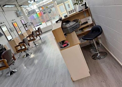Elegant interior of The Glam Loft in Auckland, Auckland, NZ showcasing modern salon chairs and sleek decor.