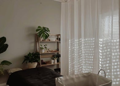 Calming therapy room at SASA Beauty Studio, Saint Albans, Victoria, AU with lush plants and soft curtains.