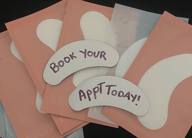 Eye mask packets with 'Book Your Appt Today!' at BNE Beautyy, Yarrabilba, Queensland, AU.