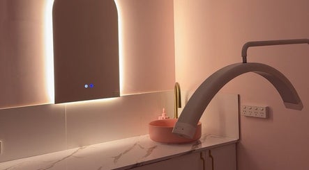 Modern beauty station at Isla Grace Beauty Studio, Butler, Western Australia, AU featuring soft pink hues and lighting.