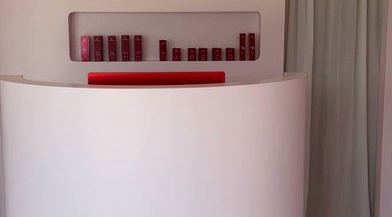 Elegant reception area at Isla Grace Beauty Studio in Butler, Western Australia, AU with product display.