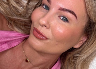 Client with glowing skin at Isla Grace Beauty Studio in Butler, Western Australia, AU, showcasing natural beauty.