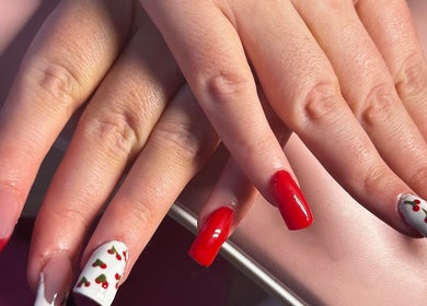 Elegant cherry nail art at NailsByZeff, Bridgwater, England, GB showcasing red and white designs.