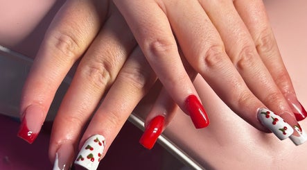 Cherry-themed nail art at NailsByZeff, Bridgwater, England, GB showcasing vibrant red and white designs.