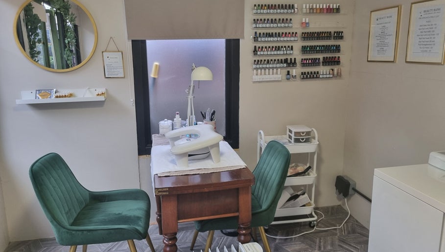 Beauty Bank in Clitheroe, England, GB offers a cozy nail care space with elegant seating and organized supplies.