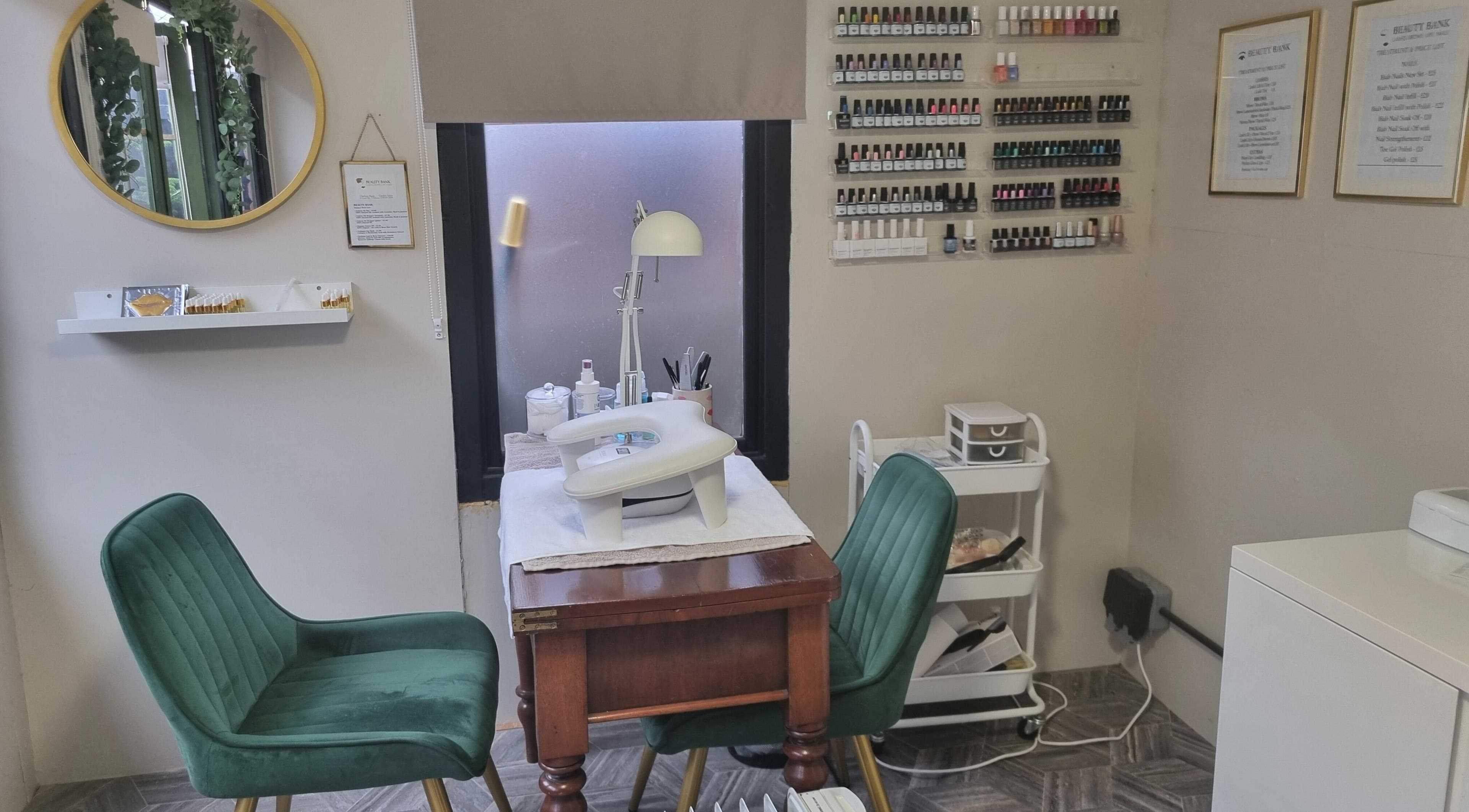 Beauty Bank in Clitheroe, England, GB offers a cozy nail care space with elegant seating and organized supplies.