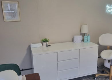 Calm beauty salon interior at Beauty Bank, Clitheroe, England, GB featuring modern decor and cozy seating.