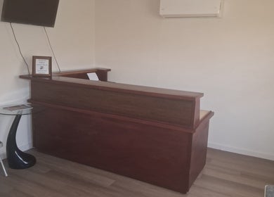 Dolizanel Medical's reception area in Oistins, Christ Church, BB with modern desk and seating.