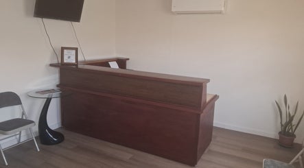 Dolizanel Medical's reception area in Oistins, Christ Church, BB with modern desk and seating.