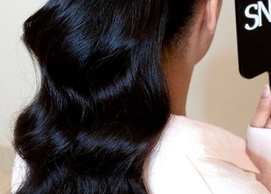 Silky wavy hair styled at Snails, Riyadh, Riyadh Province, SA, reflecting beautiful grooming services.