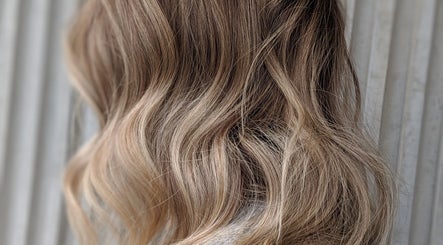 Elegant blonde waves styled at Jarod.hair, Surry Hills, New South Wales, AU.
