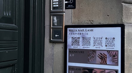 Bella Naillash entrance sign with service details and QR codes in Manchester, England, GB.
