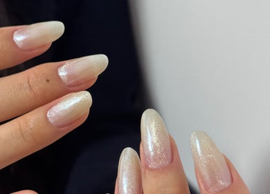 Shimmery styled nails at Bella Naillash, Manchester, England, GB, showcasing elegant nail art.