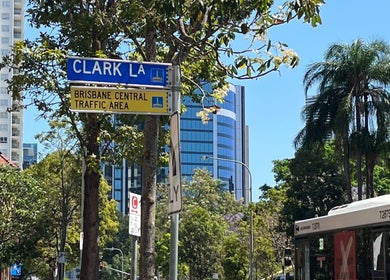 Clarkie Station at Clark Lane in Milton, Queensland, AU, nestled among lush trees and modern buildings.