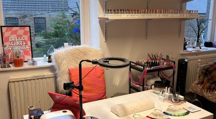 Cozy nail art station at Haus of Pixiee, Pontyclun, Wales, GB, featuring vibrant gel polish display.