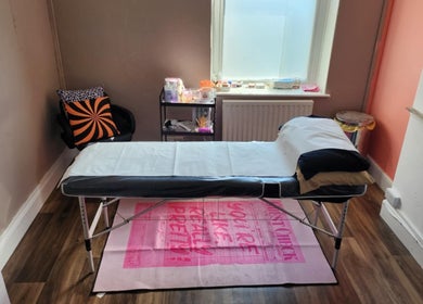 Cozy treatment room at Haus of Pixiee, Pontyclun, Wales, GB, featuring a comfortable massage table.