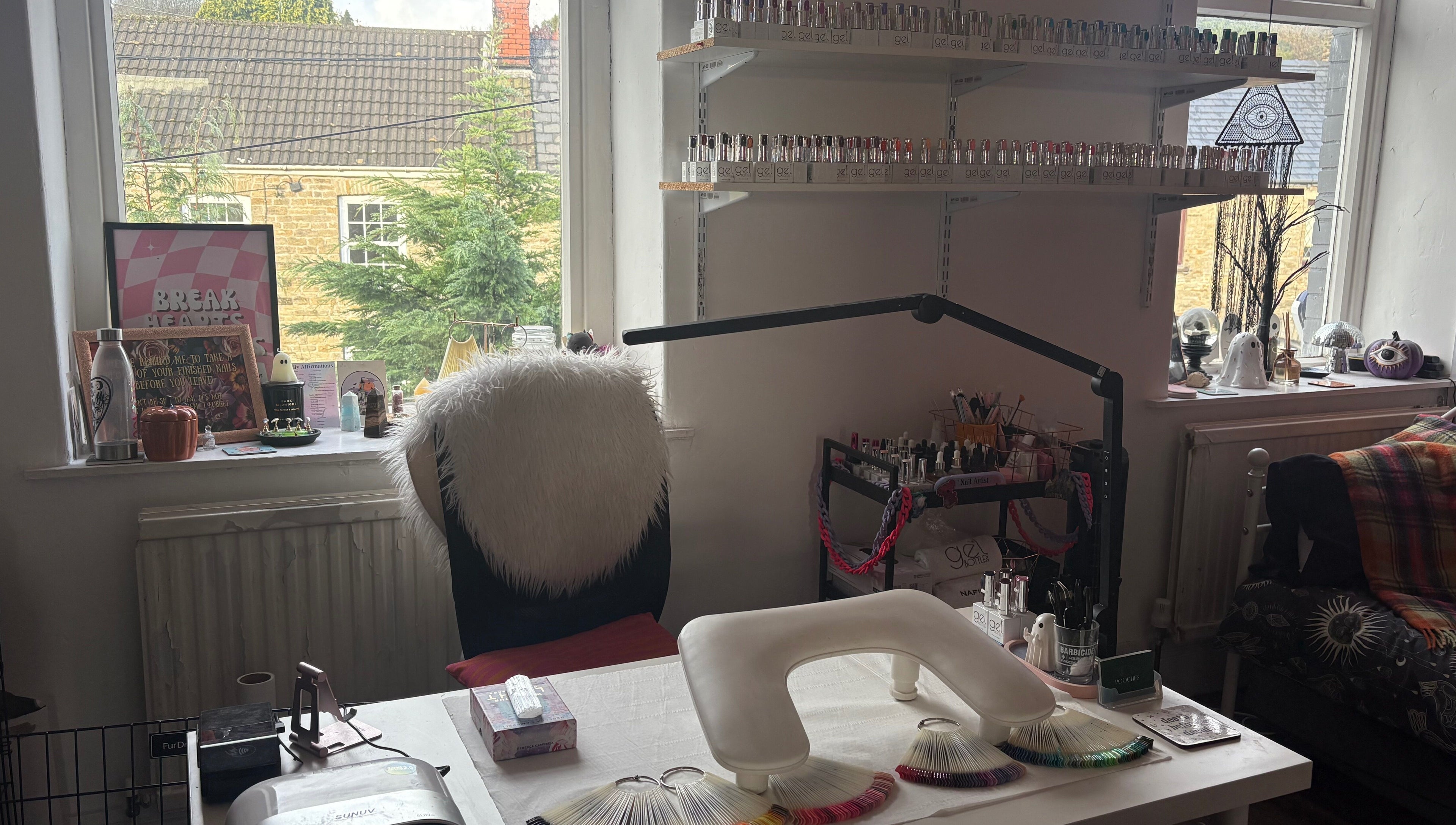 Cozy nail station at Haus of Pixiee, Pontyclun, Wales, GB, featuring elegant decor and nail polish display.