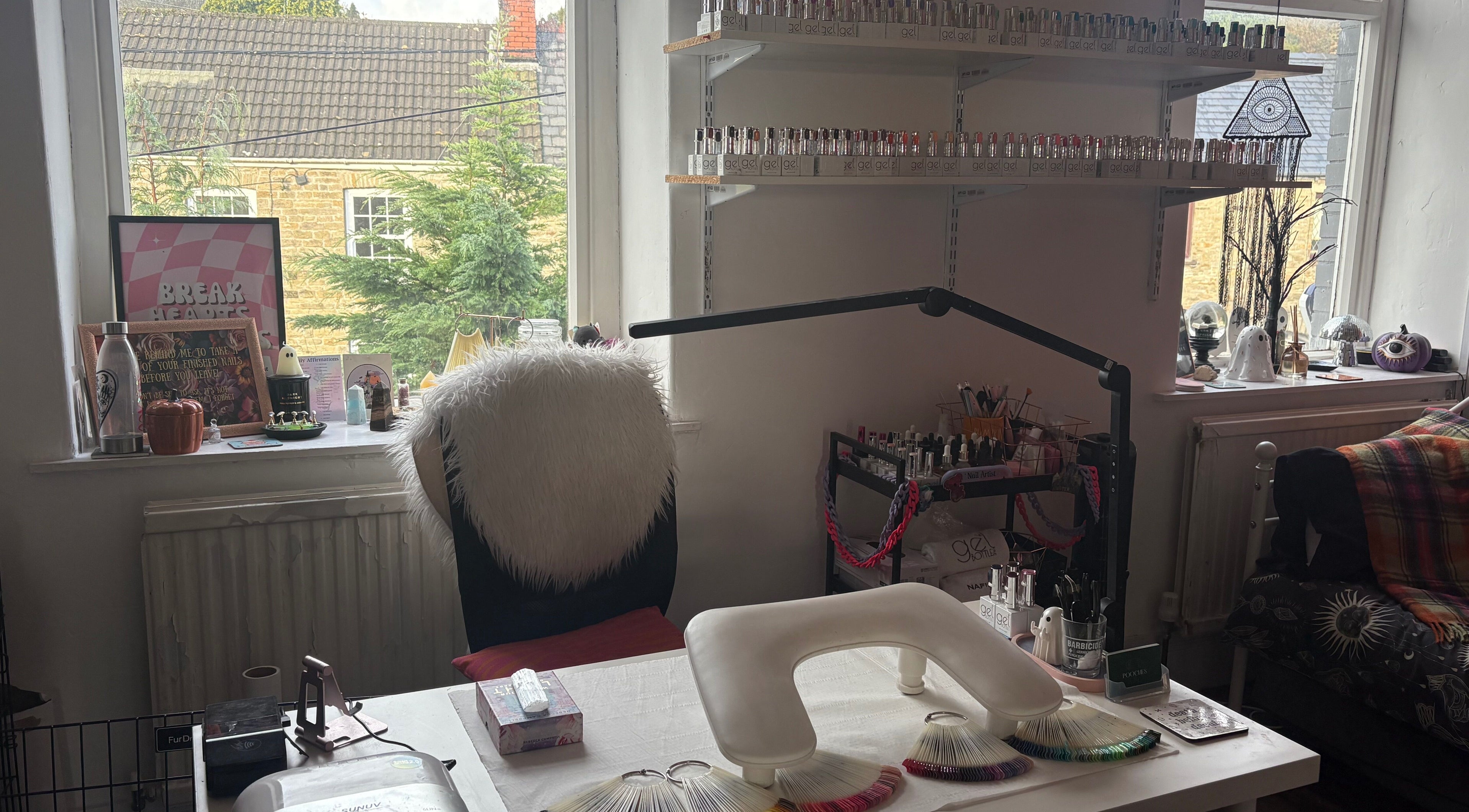 Cozy nail station at Haus of Pixiee, Pontyclun, Wales, GB, featuring elegant decor and nail polish display.